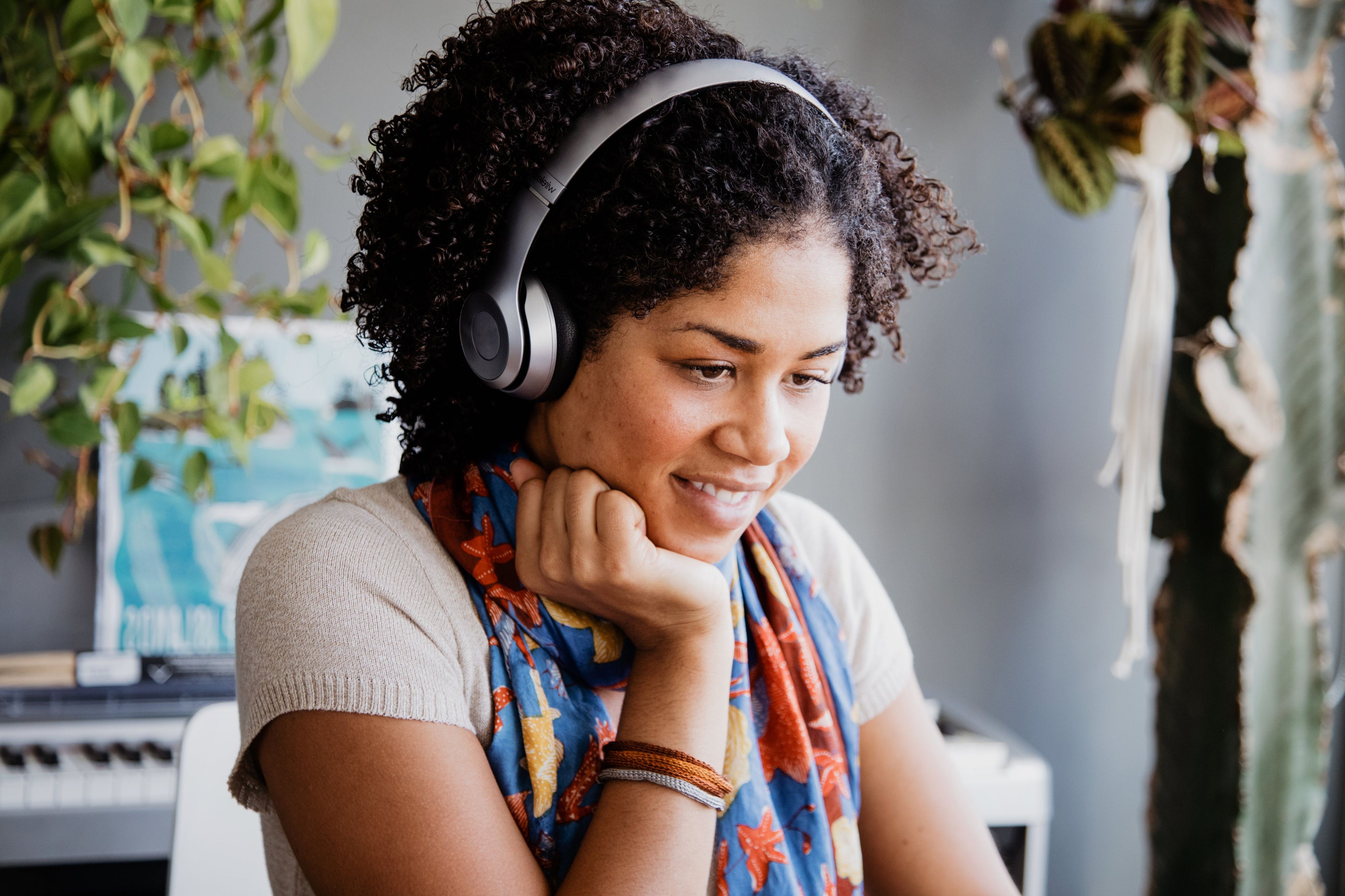 Woman wearing headset smiling.